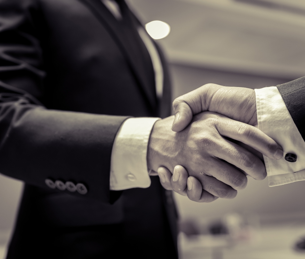 Business people shaking hands, finishing up a meeting,Negotiations were successfully