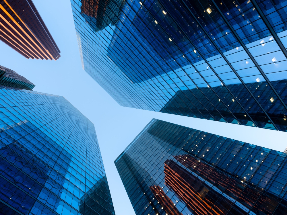 Real Estate. Financial Center. High office buildings in the business center of the city. Glass and steel. Skyscrapers as a background.